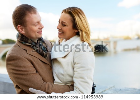Portrait of affectionate couple having good time outside