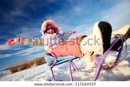 Happy girl in winterwear having happy time outside