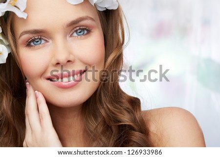 Spring portrait of a woman with magnificent blue eyes