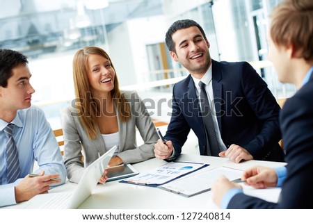 Image Of Business Partners Laughing During Interaction At Meeting