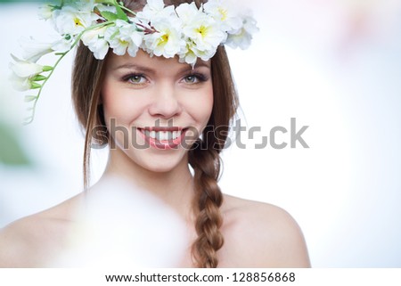 Isolated portrait of a gorgeous young woman expressing the spirit of spring