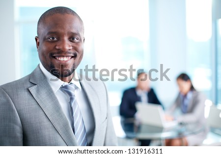 Image Of African-American Business Leader Looking At Camera In Working Environment