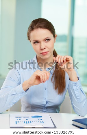 Vertical image of a young business lady having ambitious thoughts