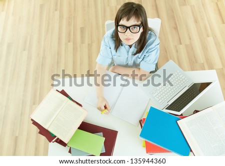 Image of an excellent female student sitting at desk