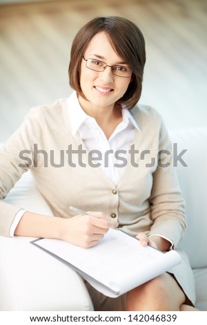 Vertical portrait of a successful psychologist or a businesswoman