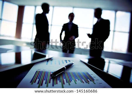Shadowy Business Trio Holding A Briefing Concerning The Reported Statistic Data