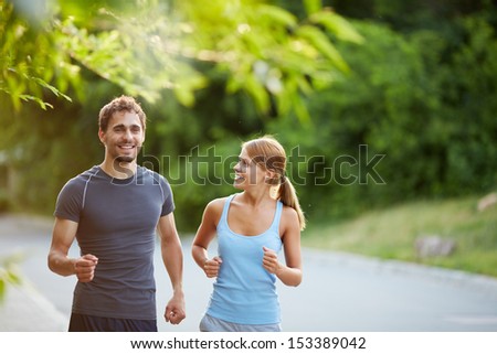 Photo of happy couple jogging on summer morning Photo of happy couple jogging on summer morning