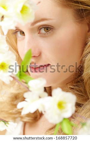 Portrait of an enigmatic lady with white flowers