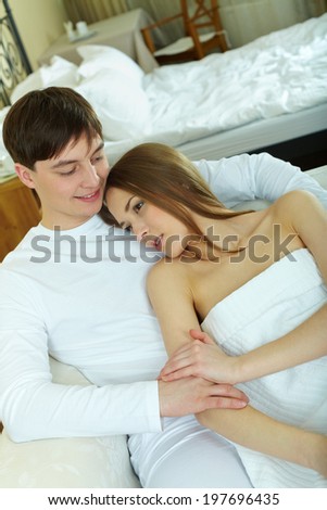Young woman and her husband having rest at home