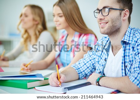 Young people writing lecture