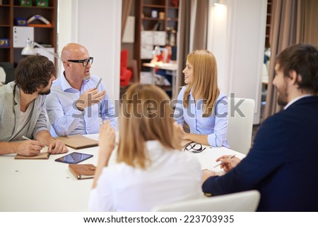 Business people communicating at meeting in office