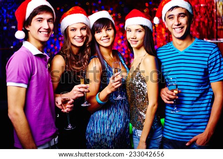 Portrait of five young people celebrating New Year
