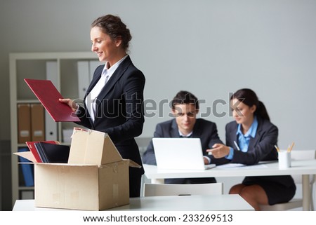 Female employer unpacking her things