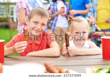 Little children at barbecue with family