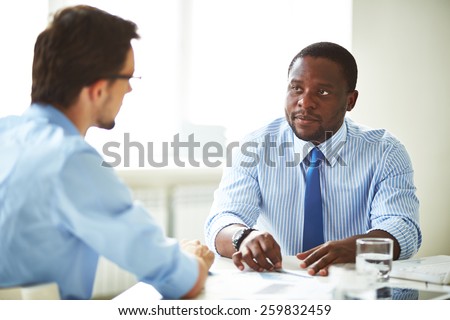 Serious manager talking to a candidate