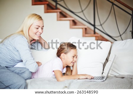 Happy family spending time in front of laptop