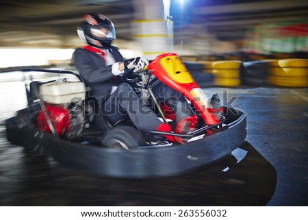 Businessman enjoying kart racing