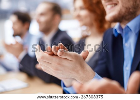 Male hands applauding after presentation of project at conference