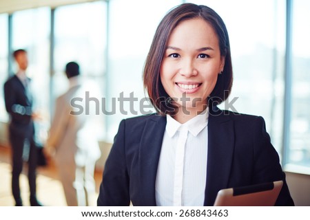 Female business leader looking at camera