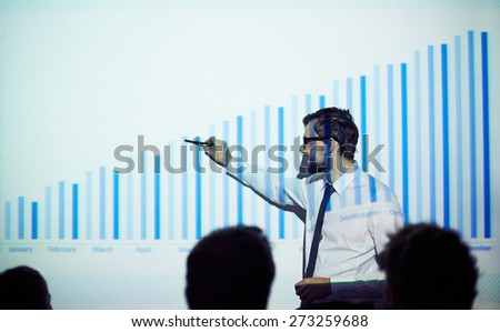 Handsome manager presenting report of progress in business