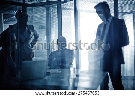 Business team consulting or planning work at meeting