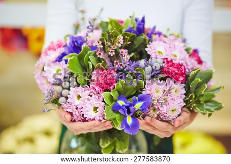 Florist hands with big floral bouquet