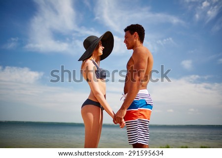 Amorous couple spending vacation by the sea