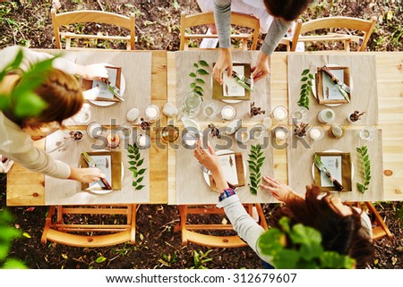 Thanksgiving table being served by waitresses