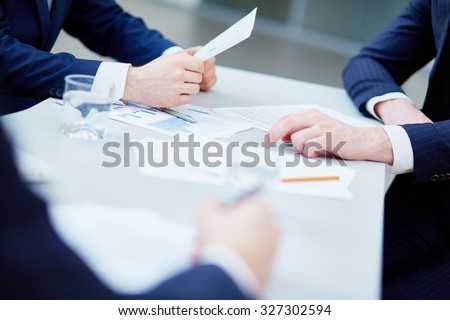 Group of businessmen working with papers