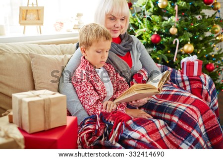 Grandma reading Christmas story to her grandson