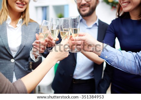 Group of colleagues toasting with champagne