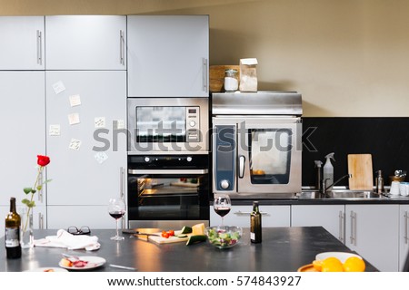 Empty kitchen with home appliances and food