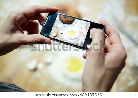 Chef making picture of flour and raw egg