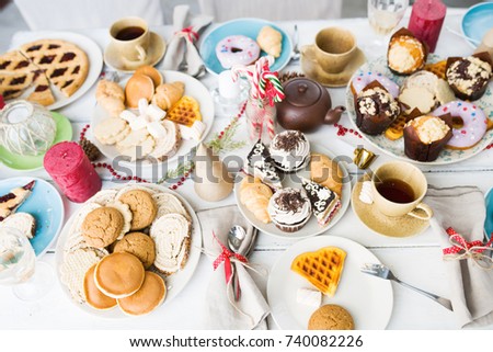 Overview of various pastry and sweet things for guests on holiday table