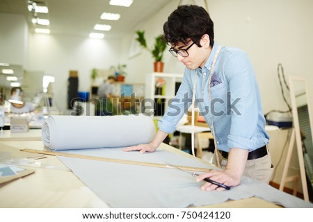 Craftsman thinking about size of fabric piece for new model of clothing
