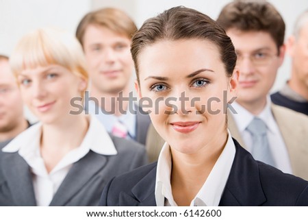 Photo of female leader with her business team