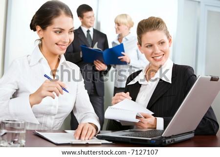 Business woman is giving a consultation to her colleague on the background of business people