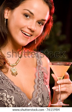 Portrait of wonderful woman holding her alcoholic drink