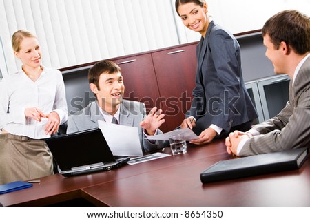 Portrait of confident business people discussing a project in a boardroom