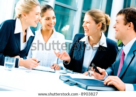 Image of laughing confident people planning a business-strategy