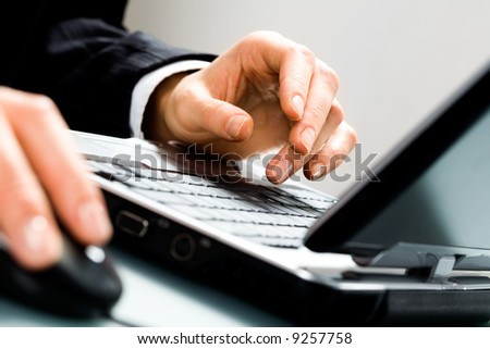 Image of human hands doing some computer work Image of human hands doing some computer work