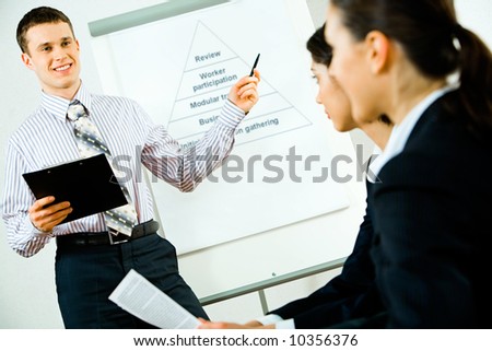 Portrait of successful business man teaching a lecture in the conference room