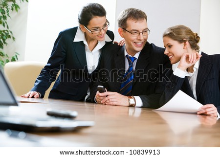 Image of business team sitting at the table in the office