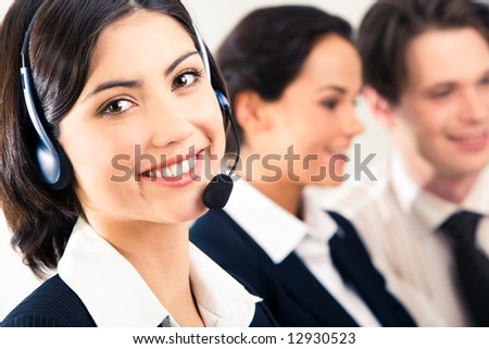 Face of pretty girl wearing headphone on the background of two speaking people