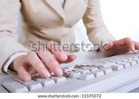 Close-up of females hands above keyboard during typing