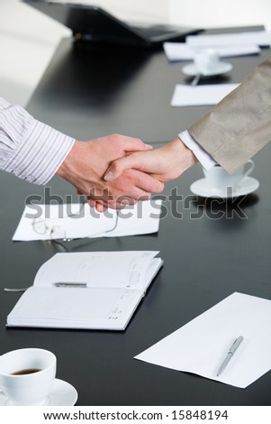 Black And White People Shaking Hands. stock photo : Image of business people shaking hands over workplace