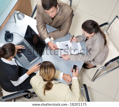 Above view of executive people interacting at corporate meeting
