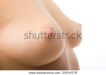 stock photo Closeup of young female breasts over white background