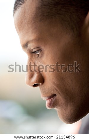 Profile of man?s face with calm expression on it over blurry background