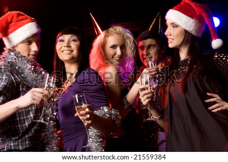 Portrait of modern young people enjoying themselves at New Year party